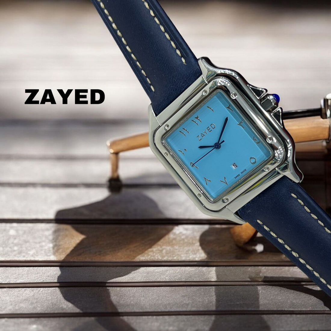 ساعة زايد سويسرية الصنع بمينا زرقاء سماوية وسوار أزرق للرجال
